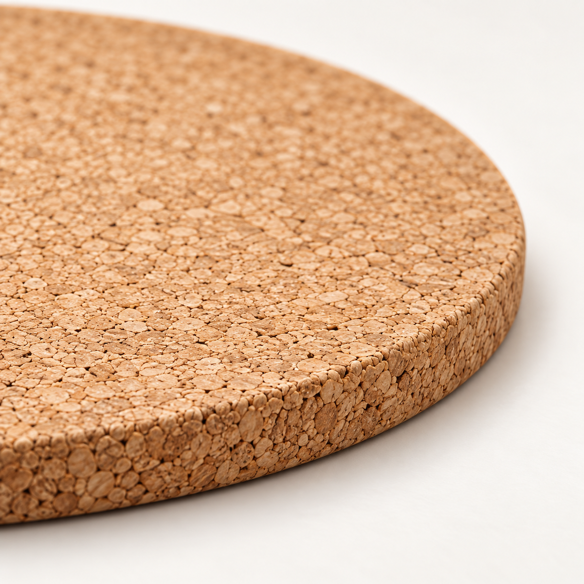 Macro close-up of natural agglomerated cork trivet texture and 9 mm edge