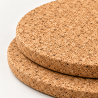 Macro close-up of natural cork trivets from the three-piece round set