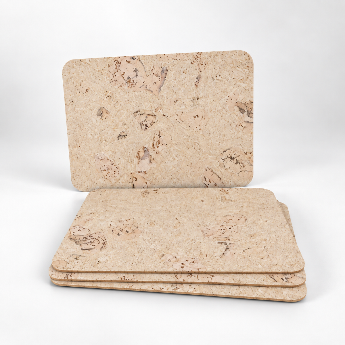 Stack of four Saphire cork placemats showing thin profile and rounded corners