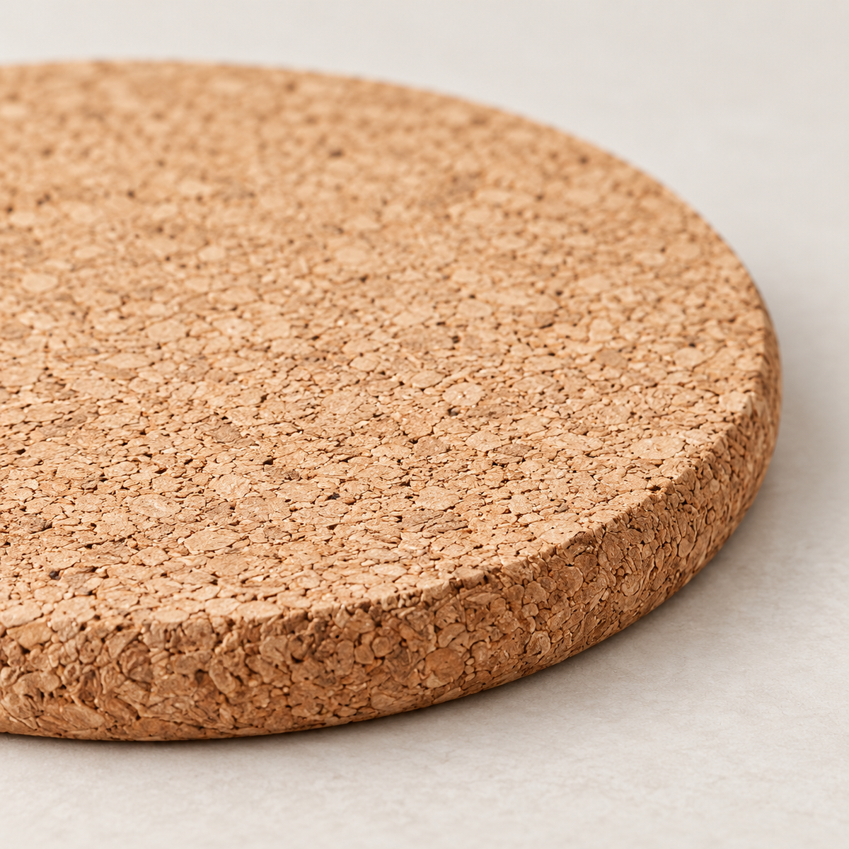 Macro close-up of slim round cork coaster surface and 5 mm edge