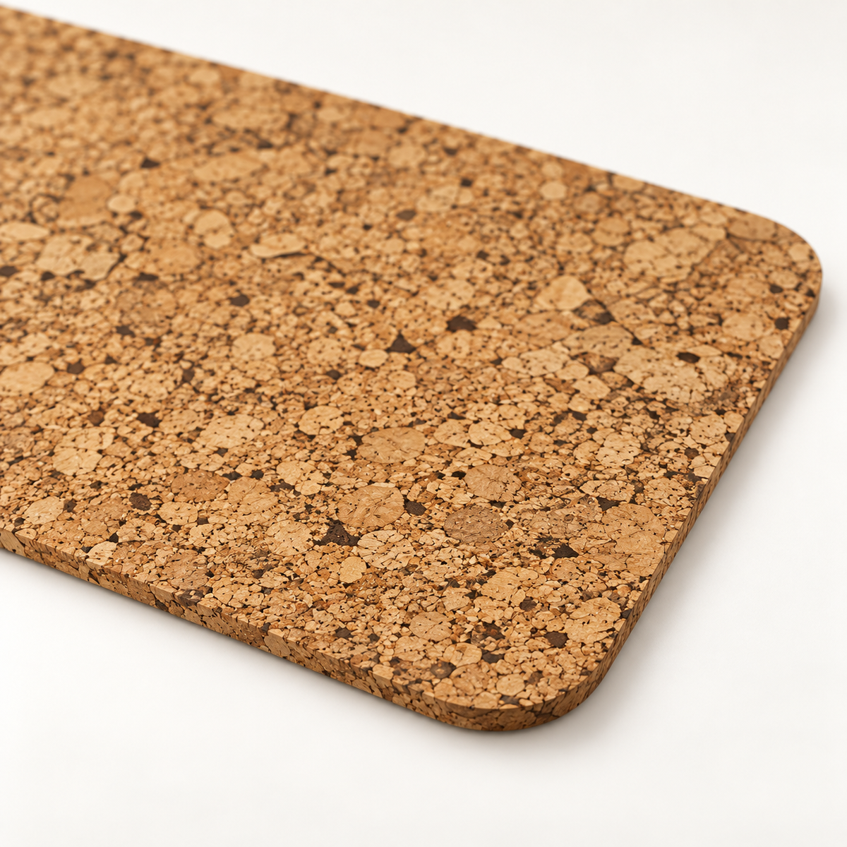 Macro close-up of small rectangular cork placemat surface, rounded corner and thin edge