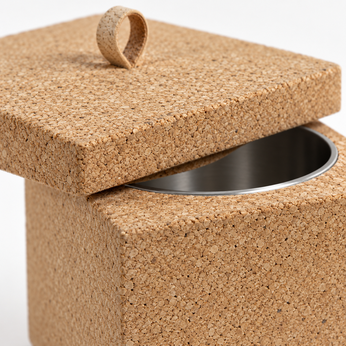 Macro detail of natural cork texture, lid edge, loop detail and metal insert on square cork cooler