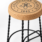 Macro detail of natural cork seat, top marking and black metal frame on XL Cork & Metal Stool