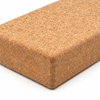 Macro detail of natural cork texture and rounded edge on XL flat cork yoga block